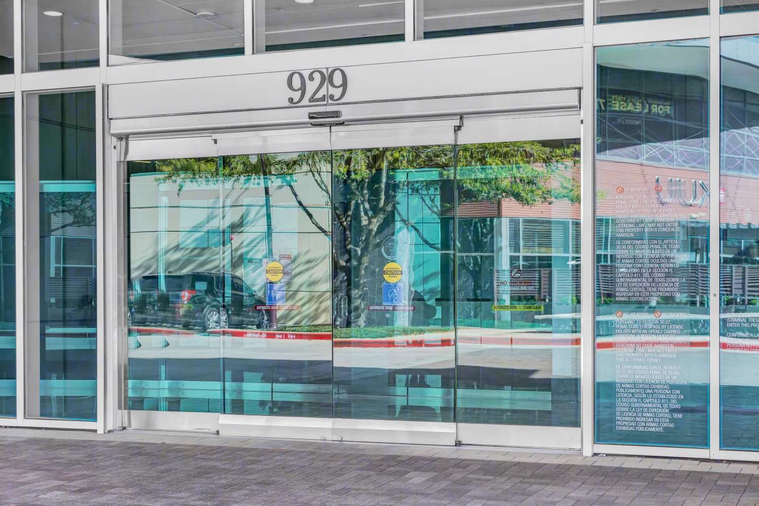 Street-level storefront at 929 Gessner Road with the building number on the glass