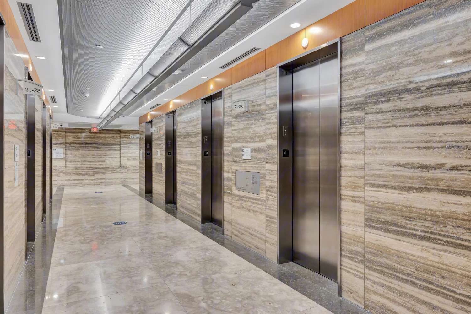 Elevator lobby at 929 Gessner Road clad in travertine