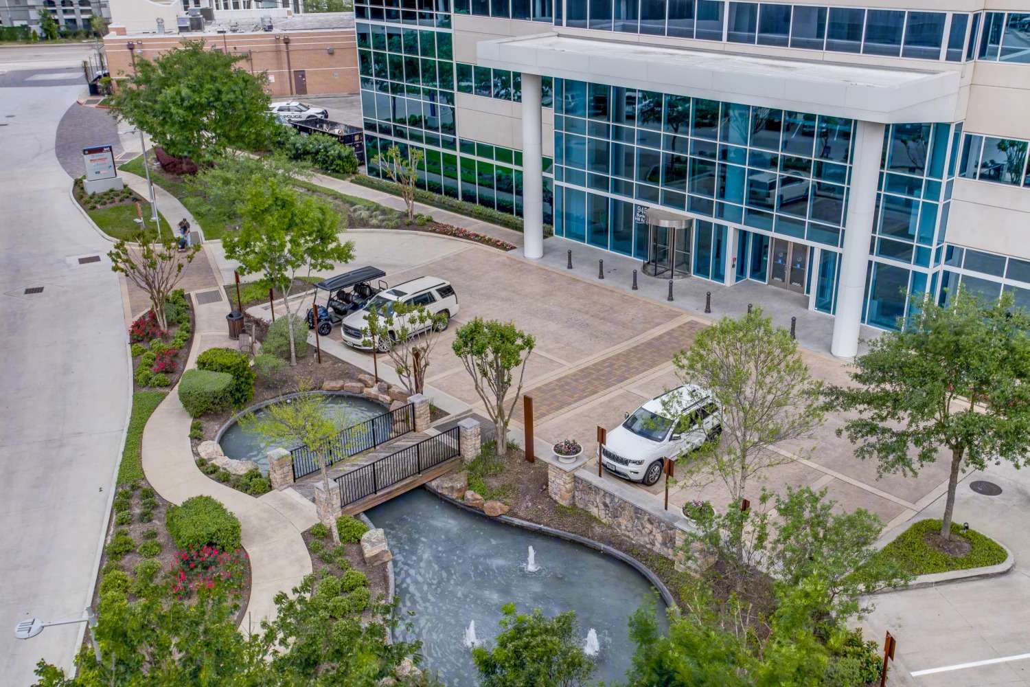Aerial view of the landscaped plaza and water feature at 945 Bunker Hill Road