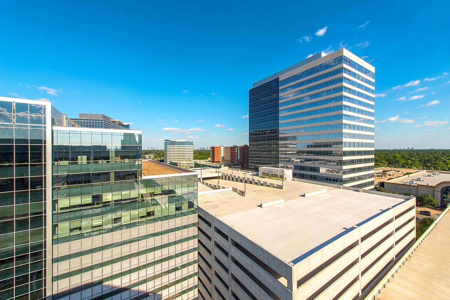 Elevated view of the office buildings and parking garage at 9811 Katy Freeway