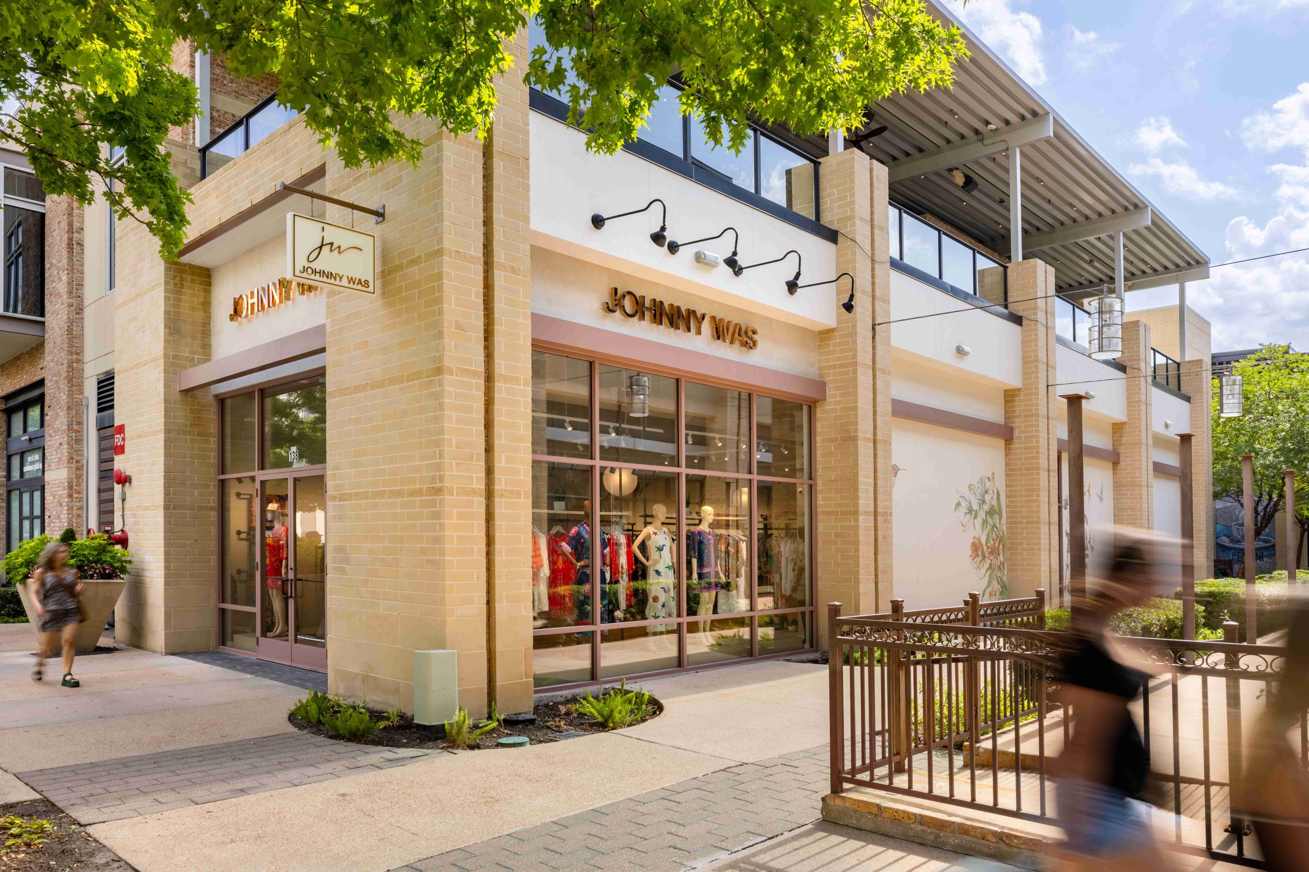 Shoppers passing the Johnny Was storefront at CityCentre