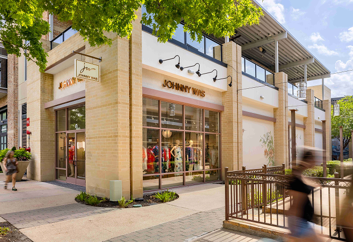 Shoppers passing the Johnny Was storefront at CityCentre