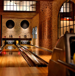 CityCentre-Unwind Bowling lanes in a brick-walled entertainment venue at CityCentre