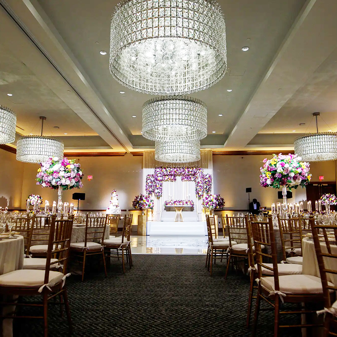 HotelZaZa-GatherBallroom1 Ballroom at Hotel ZaZa Memorial set with round banquet tables, floral centrepieces and chandeliers