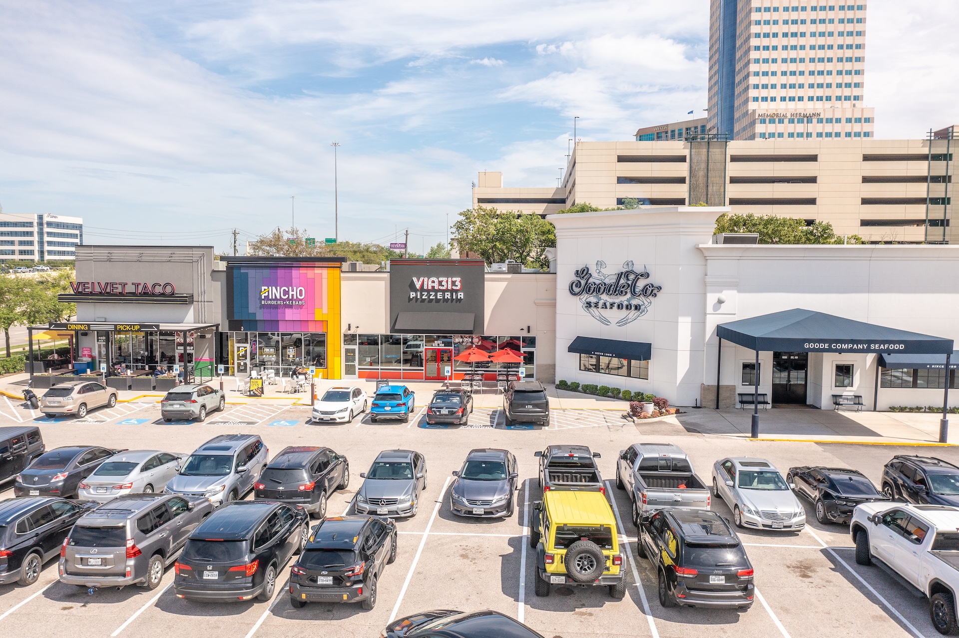 Elevated view of the storefronts and parking lot at Katy Retail Centers