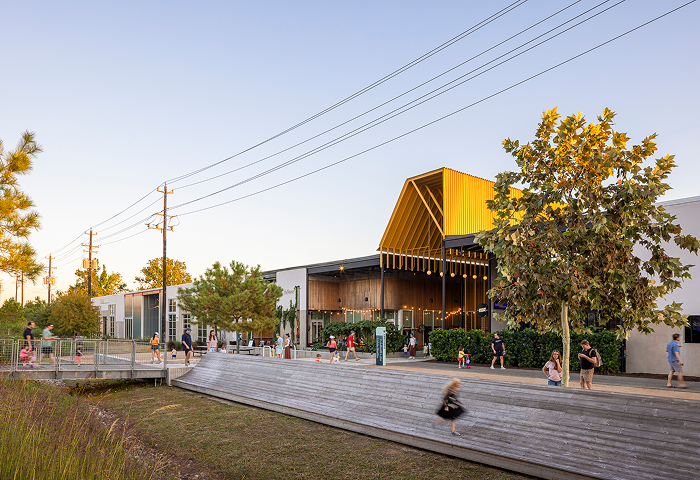 The M-K-T Heights building and boardwalk beneath its angular yellow canopy