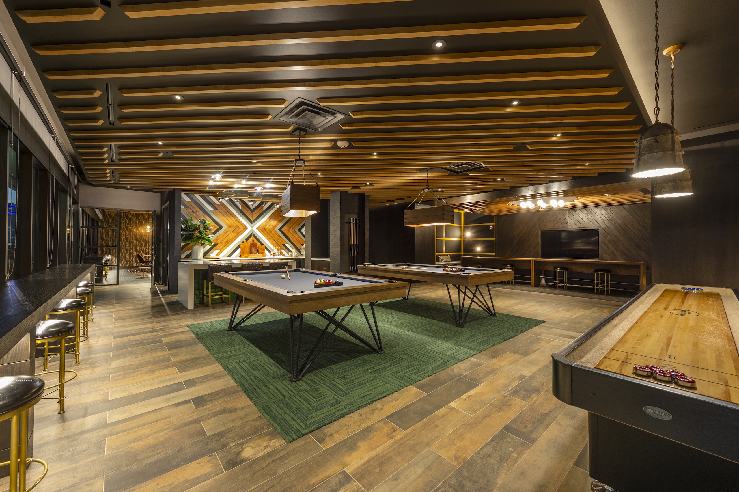 McAdams0526 Game room at The McAdams with a shuffleboard table, foosball and a wood slat ceiling