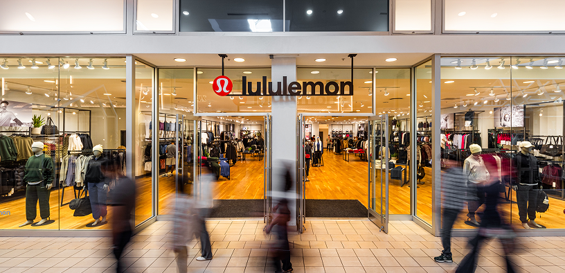Shoppers passing the lululemon storefront at Memorial City Mall
